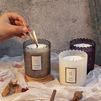 scented candle on bedside table in calm bedroom