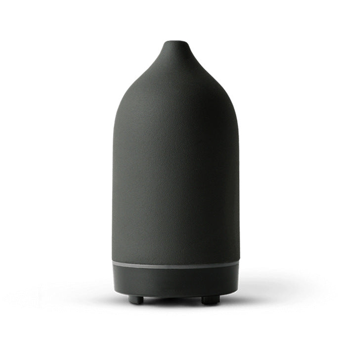 ceramic ultrasonic aroma diffuser releasing essential oil mist