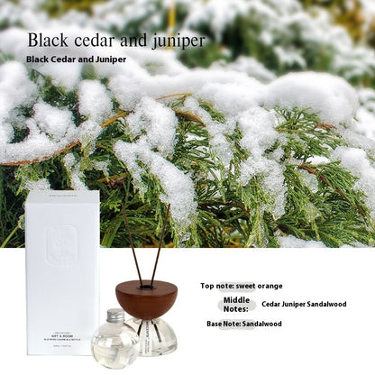 Decorative hourglass essential oil diffuser in soft neutral bedroom aesthetic