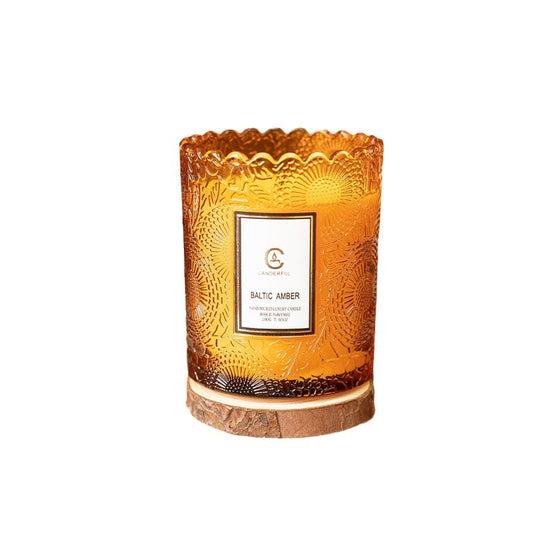 amber glass candle creating warm evening ambiance