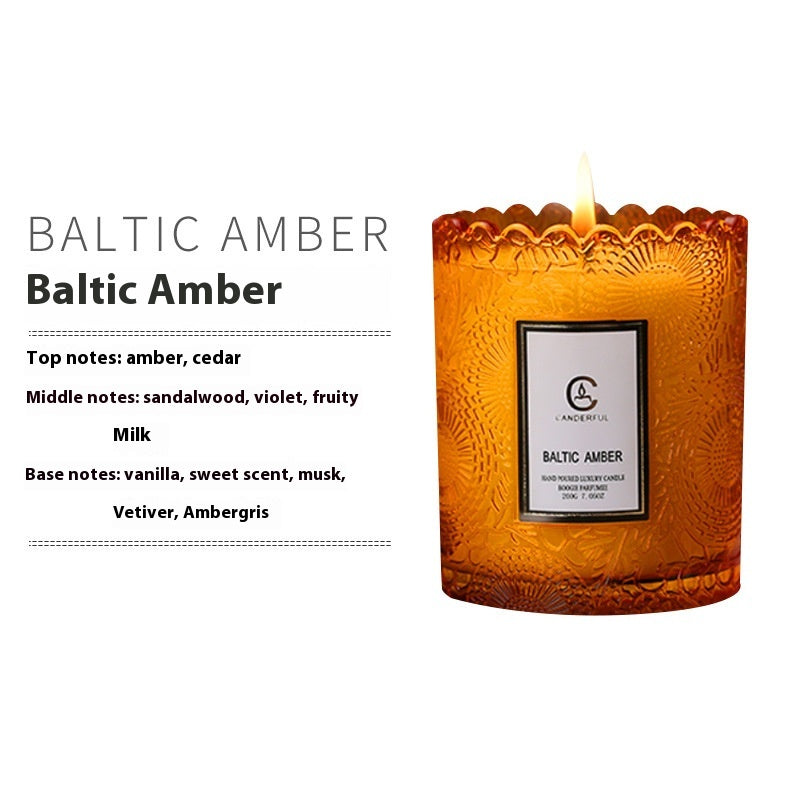 textured amber candle jar close-up with flame
