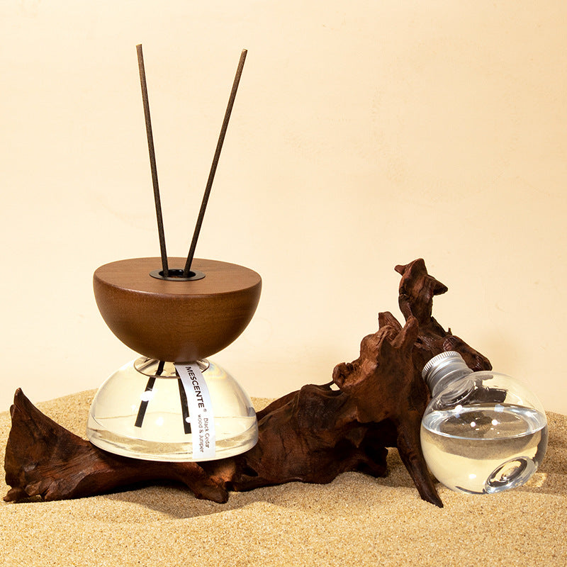 Fire-free aromatherapy diffuser hourglass design on minimalist bedside table