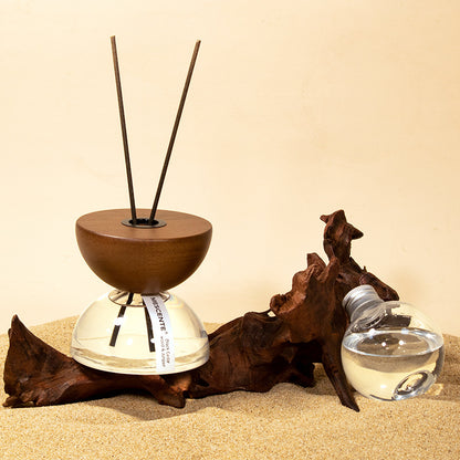 Fire-free aromatherapy diffuser hourglass design on minimalist bedside table